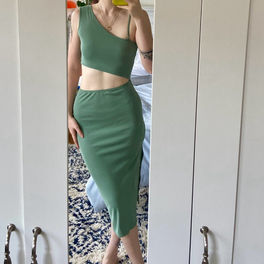 Green asymmetrical knit dress